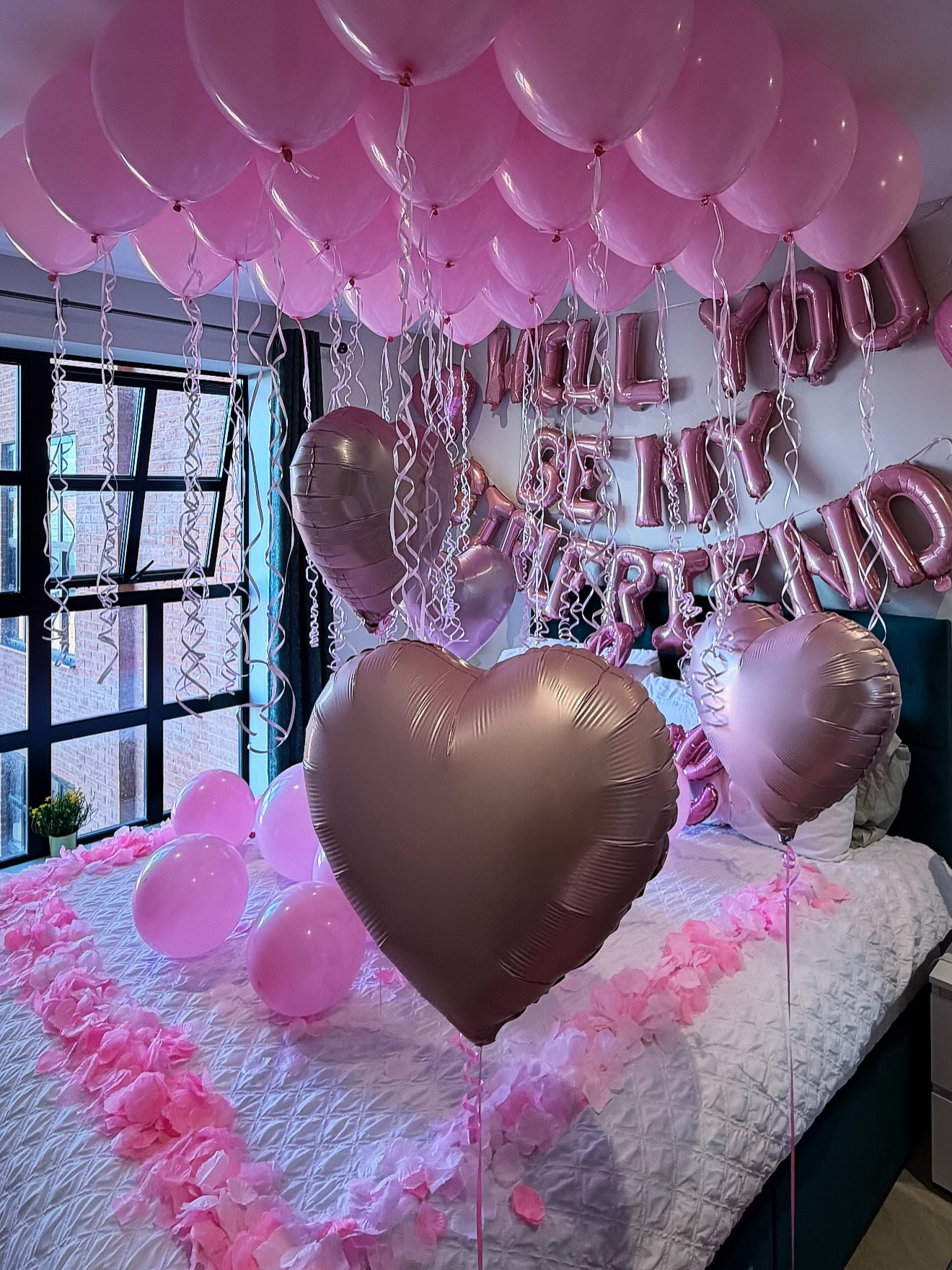 A pink room arranged for a girlfriend proposal