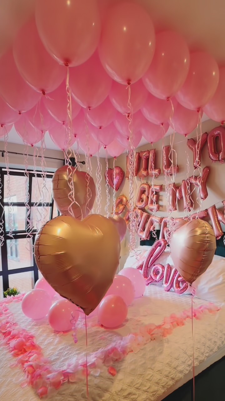 Pink balloon styling for a romantic room surprise